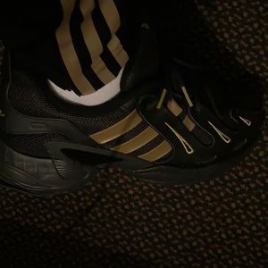 Adidas 11 1/2 black and gold.